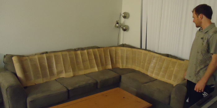 Torah scroll stretched out on couch